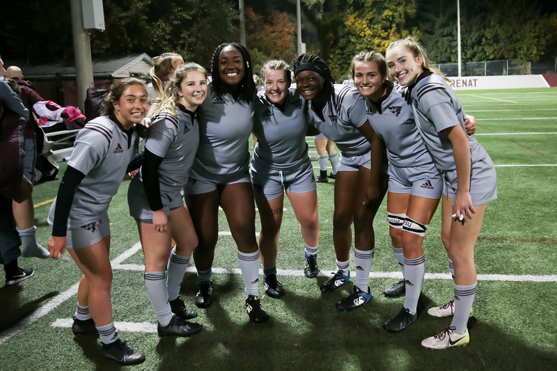 Victoria Hough, second from left and wearing a rugby playing kit, with Gee-Gees women's rugby team mates at Matt Anthony Field.