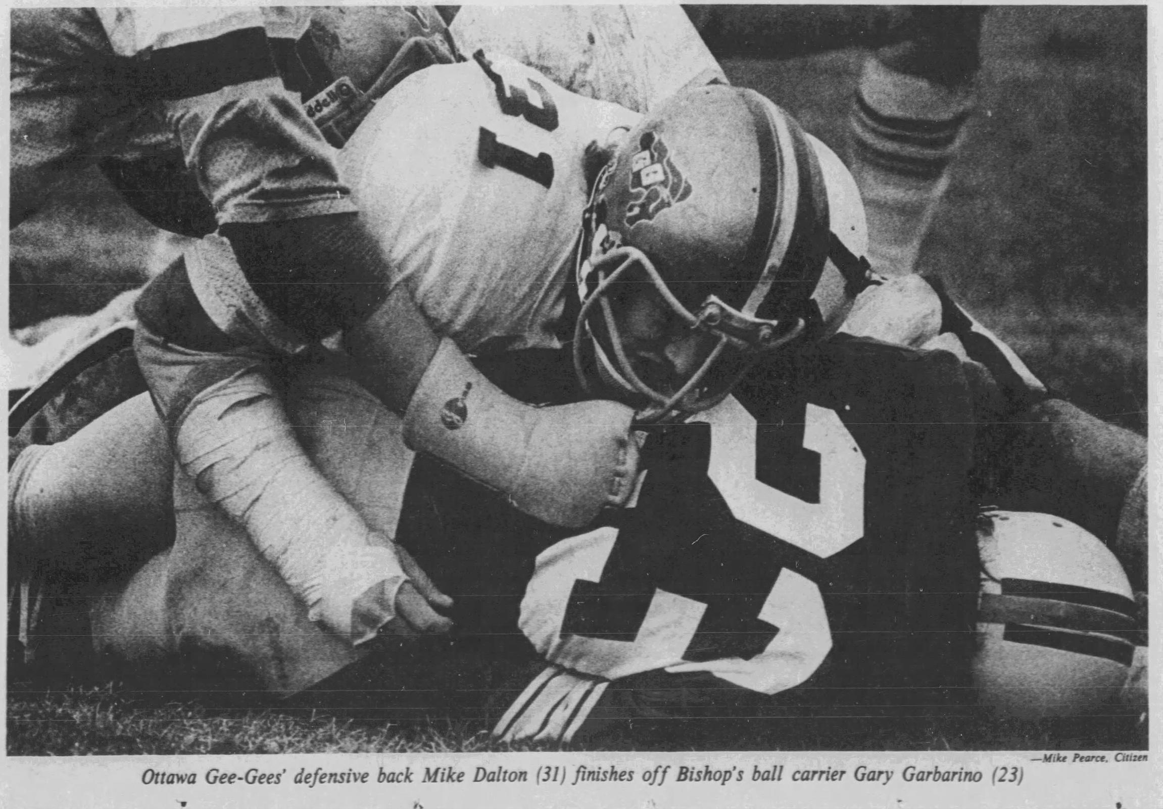 Black and white newspaper clipping shows a Gee-Gees player tackling an opponent. Caption text below reads: Ottawa Gee-Gees' defensive back Mike Dalton (31) finishes off Bishop's ball carrier Gary Garbino (23) - Mike Pearce, Citizen